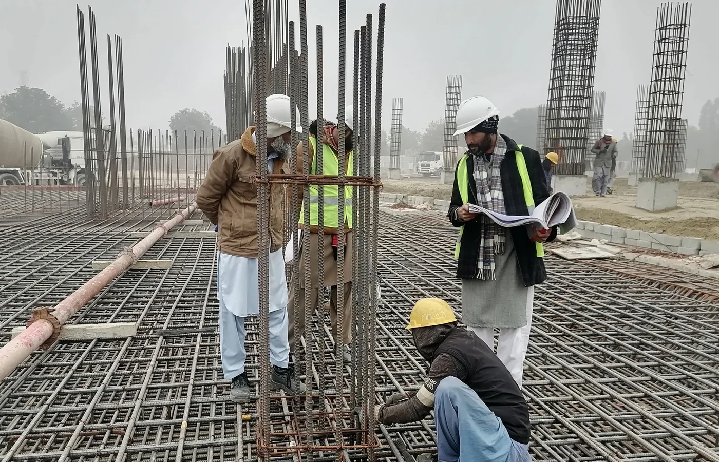 Construction team reviewing structural work on site
