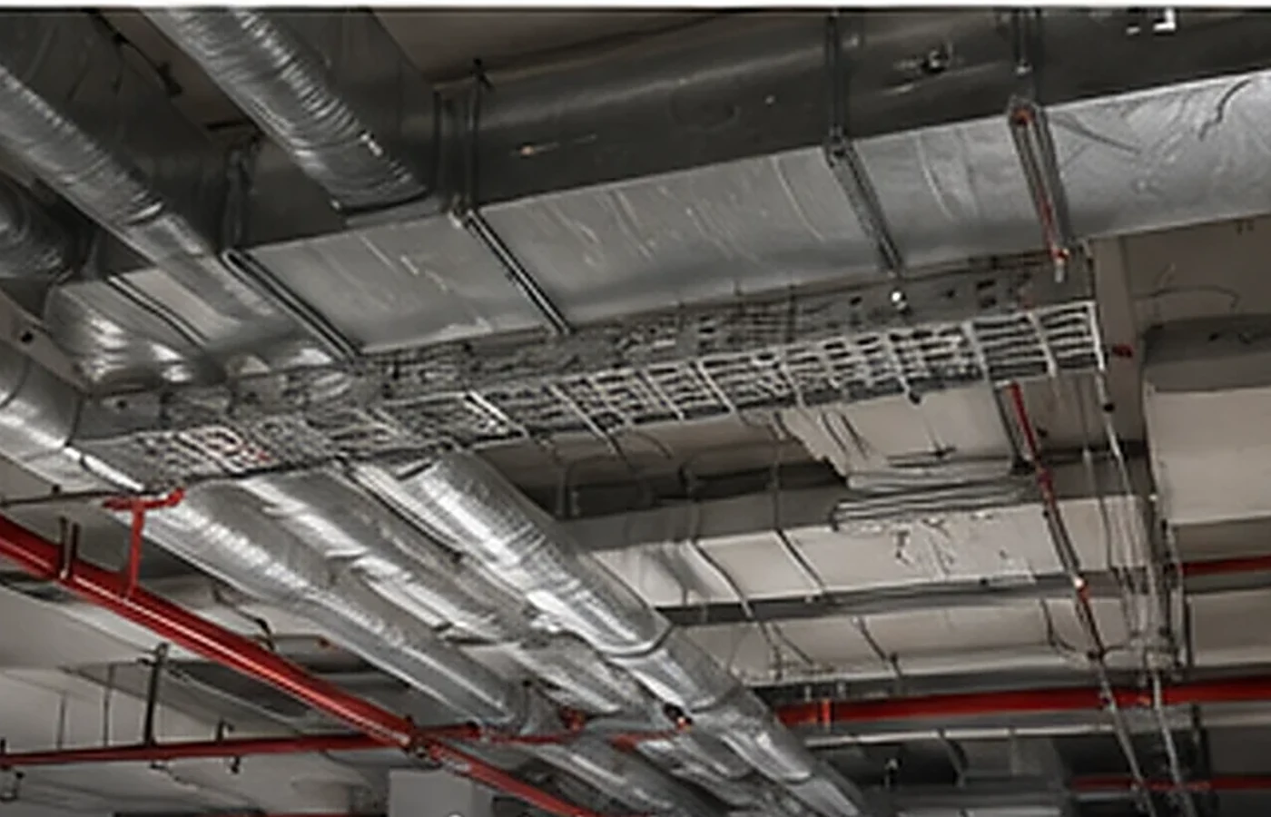 Building services coordinated above a commercial ceiling
